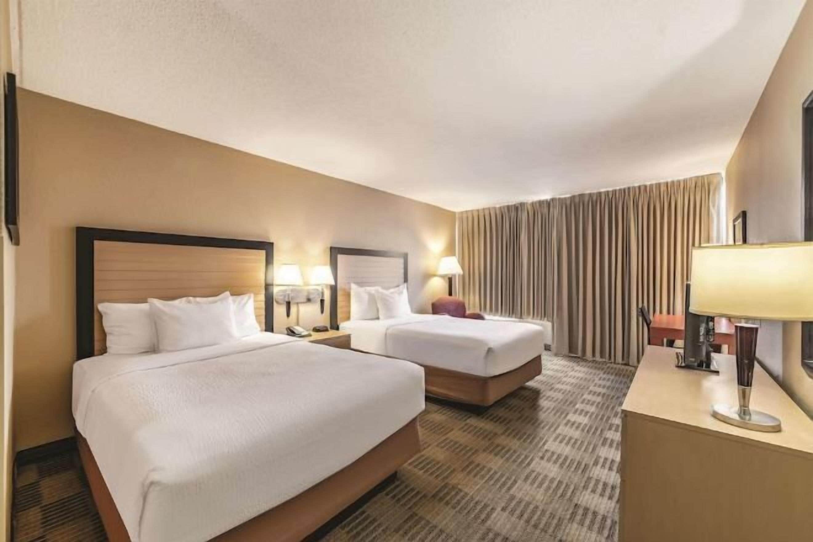 Premium bedding, desk, laptop workspace, iron/ironing board