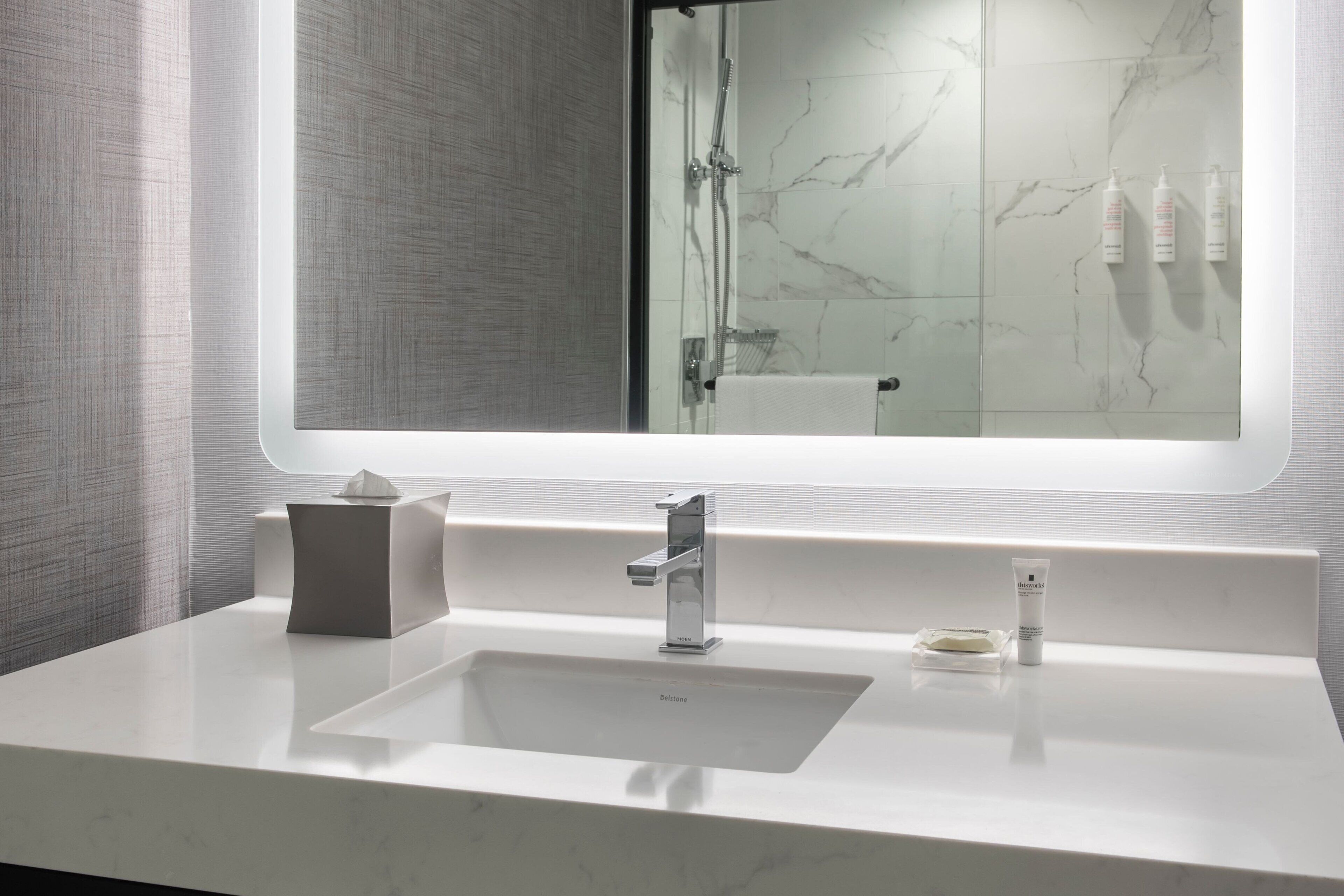 combined shower/bathtub, designer toiletries, hair dryer, towels