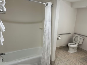 Room, 1 Queen Bed, Mobility Accessible, Non Smoking (Bathtub W/grab Bars) | Bathroom | Combined shower/bathtub, free toiletries, hair dryer, towels