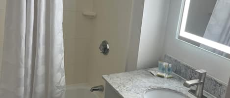 Room, Multiple Beds, Non Smoking | Bathroom | Combined shower/tub, free toiletries, hair dryer, towels
