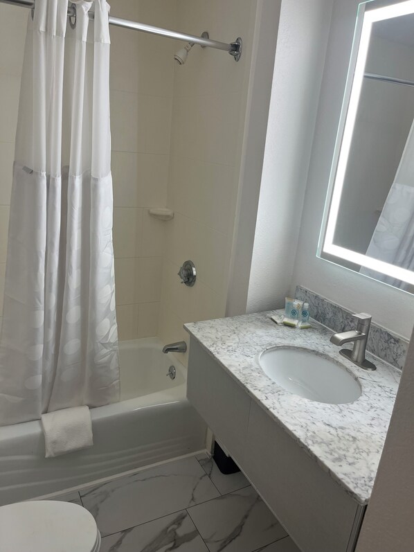 Room, Multiple Beds, Non Smoking | Bathroom | Combined shower/tub, free toiletries, hair dryer, towels