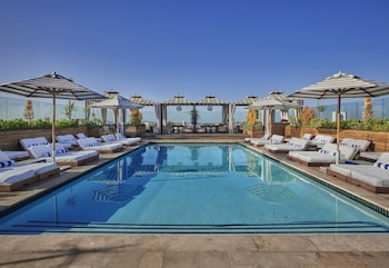 Outdoor pool, open 8:00 AM to 7:00 PM, cabanas (surcharge), sun loungers at SIXTY Beverly Hills