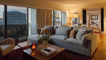 Penthouse | Living area | 55-inch flat-screen TV with cable channels, TV, iPod dock