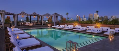 Outdoor pool, open 8:00 AM to 7:00 PM, pool cabanas (surcharge)