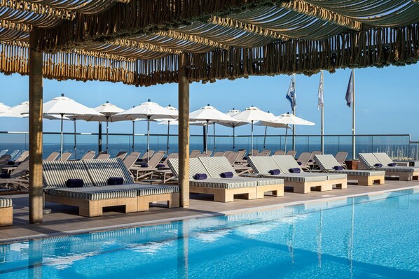 Outdoor pool, open 9:00 AM to 7:00 PM, pool umbrellas, sun loungers