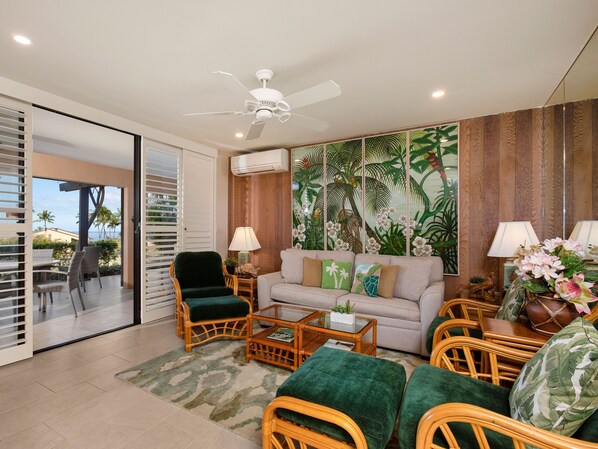 A living room with a sofa, chairs, a coffee table, and a ceiling fan. - Wailea Ekahi - CoralTree Residence Collection (Kihei)