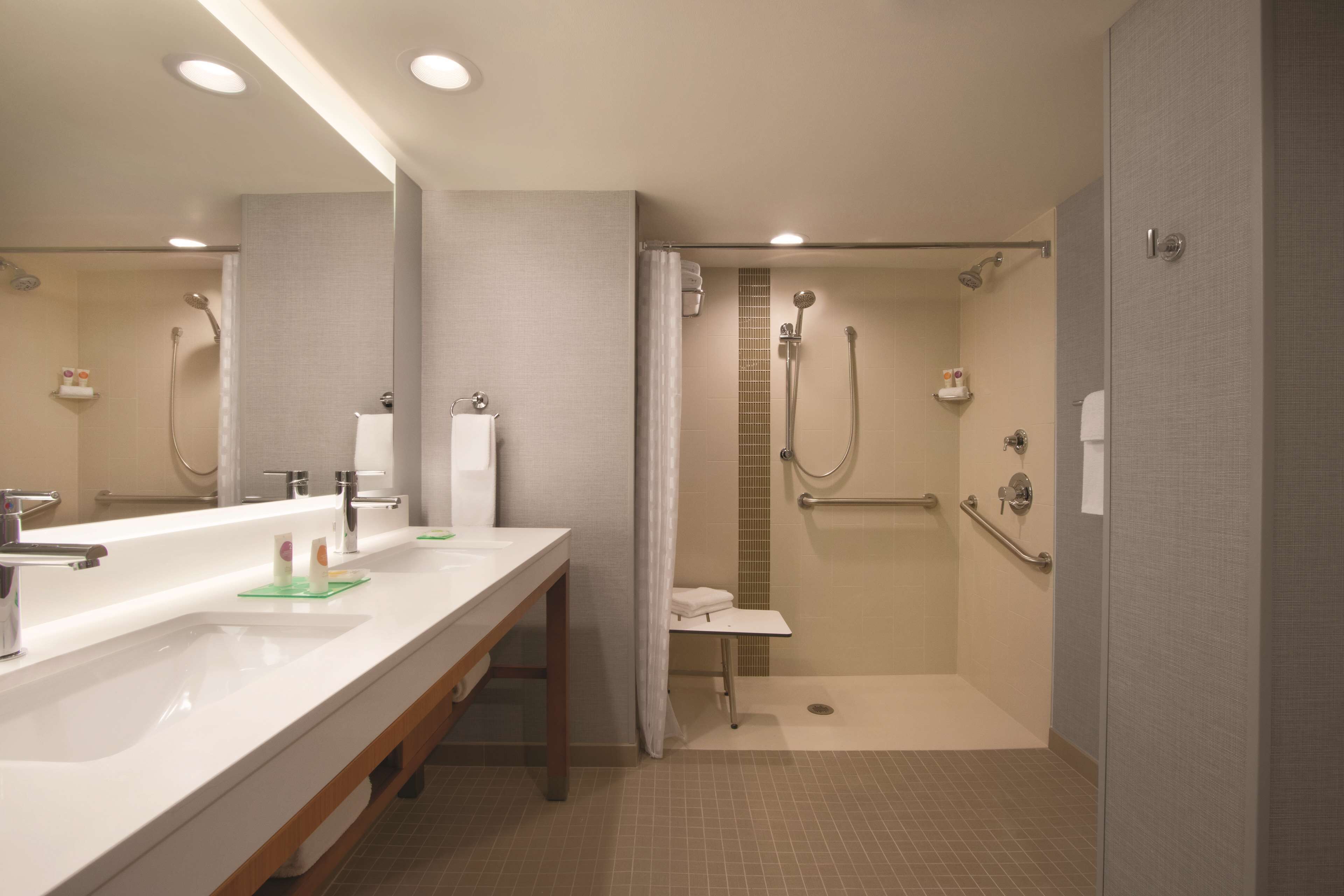 combined shower/bathtub, designer toiletries, hair dryer, towels