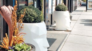 A hotel named 'Versey' with outdoor planters and a clean sidewalk. - Hotel Versey Chicago Lincoln Park (Chicago)