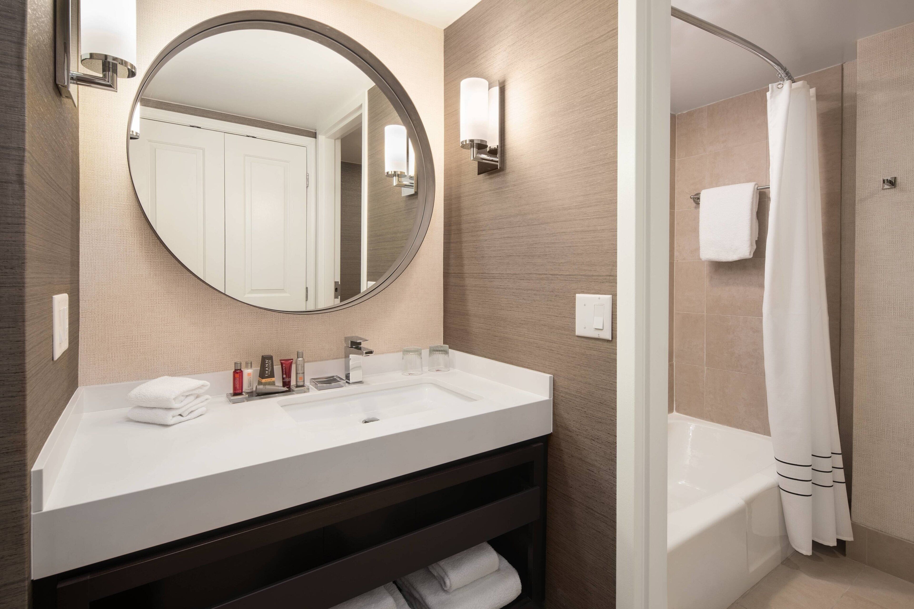 combined shower/bathtub, designer toiletries, hair dryer, bathrobes