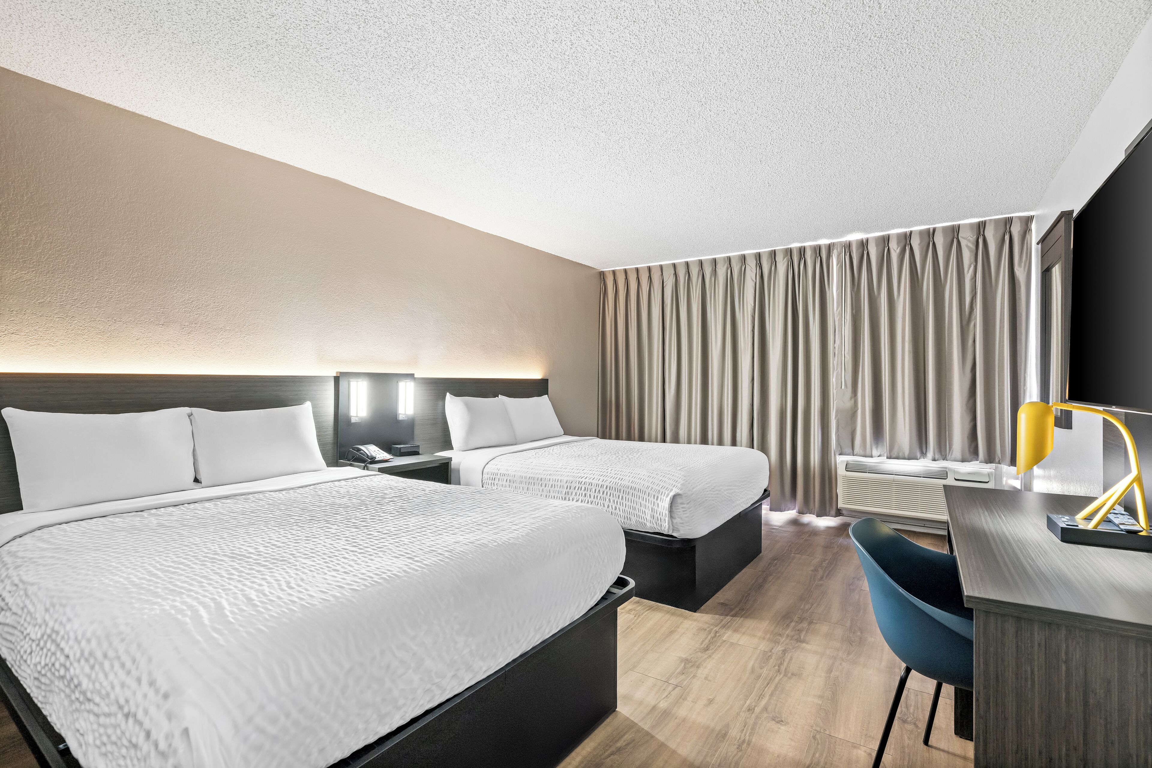 Desk, blackout drapes, iron/ironing board, bed sheets