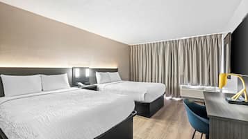 Desk, blackout drapes, iron/ironing board, bed sheets