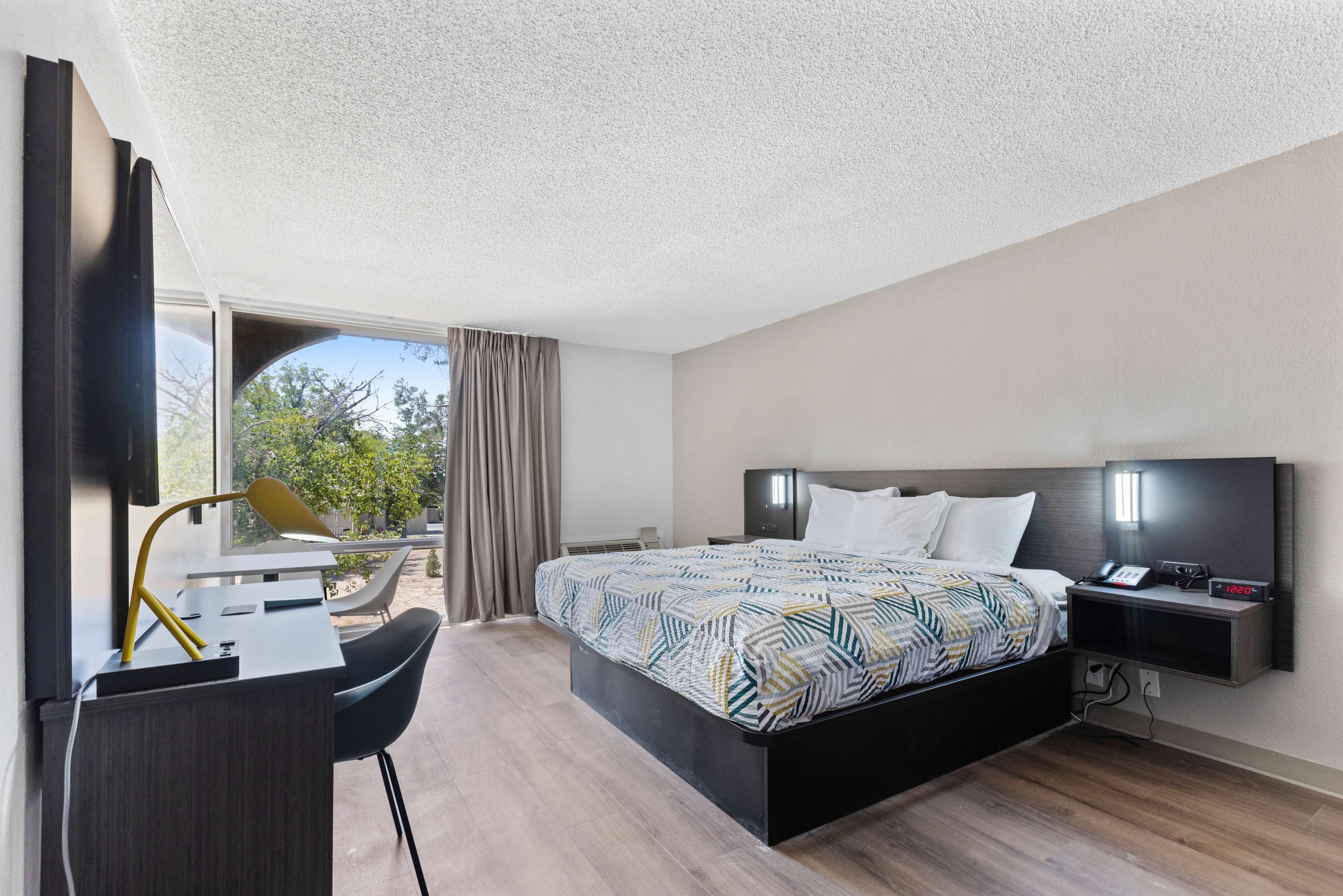 Desk, blackout drapes, iron/ironing board, bed sheets