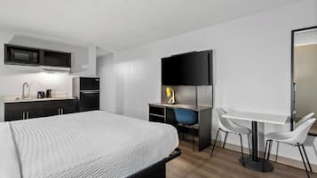 Desk, blackout curtains, iron/ironing board, bed sheets