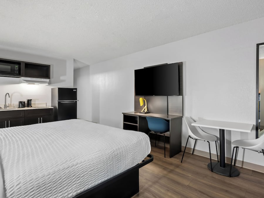 Desk, blackout drapes, iron/ironing board, bed sheets