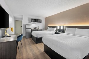 Desk, blackout drapes, iron/ironing board, bed sheets