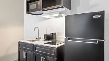 Desk, blackout drapes, iron/ironing board, bed sheets