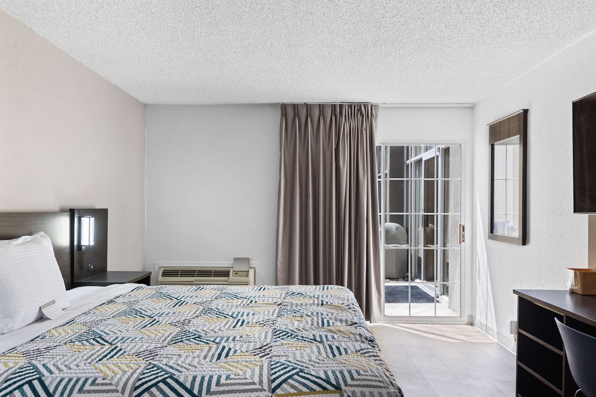 Desk, blackout curtains, iron/ironing board, bed sheets