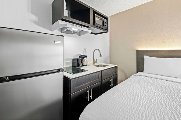 Desk, blackout drapes, iron/ironing board, bed sheets