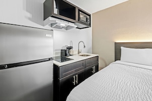 Desk, blackout drapes, iron/ironing board, bed sheets