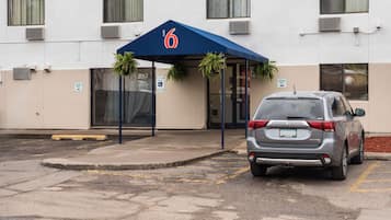 Welcome to our hotel, where guests can enter through the main entrance marked with the number 6, accessible via a set of steps.