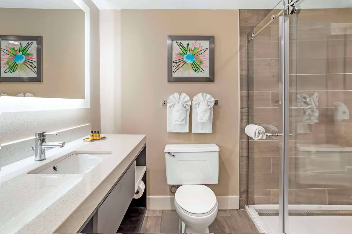 standard room, 2 queen beds, refrigerator & microwave | bathroom | combined shower/bathtub, free toiletries, hair dryer, towels