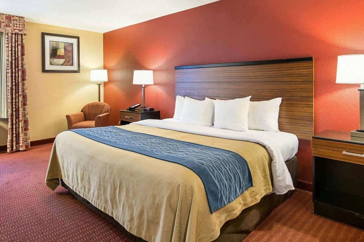 Desk, laptop workspace, blackout drapes, iron/ironing board