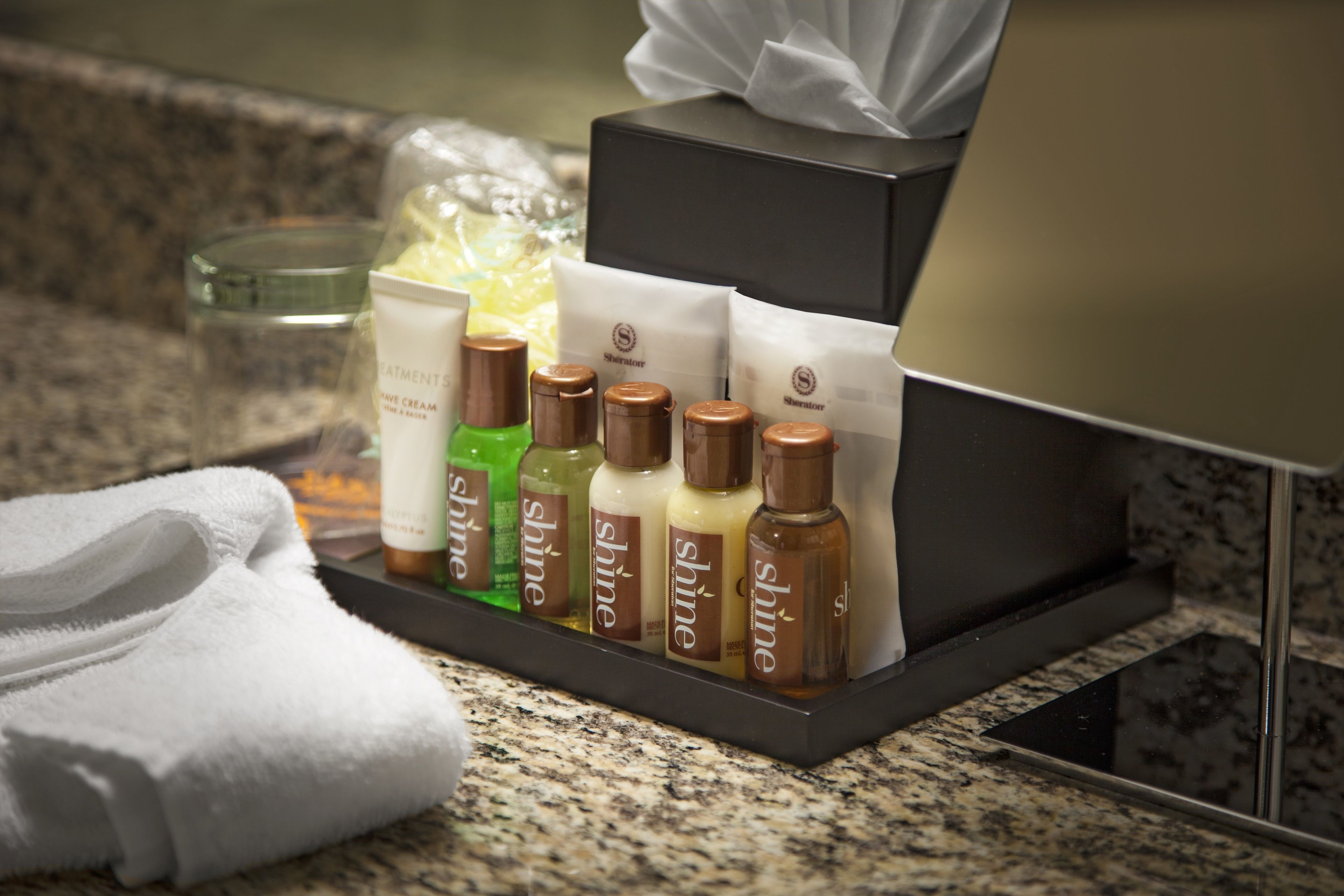 rainfall showerhead, designer toiletries, hair dryer, slippers