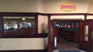 The entrance to a restaurant with a sign reading "Denny's". - Holiday Inn Lumberton by IHG (Lumberton)