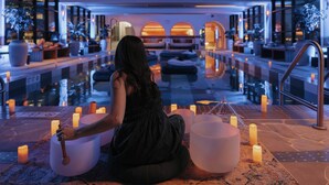 A spa area with a pool, seating, and candles. - The Westin Calgary (Calgary)