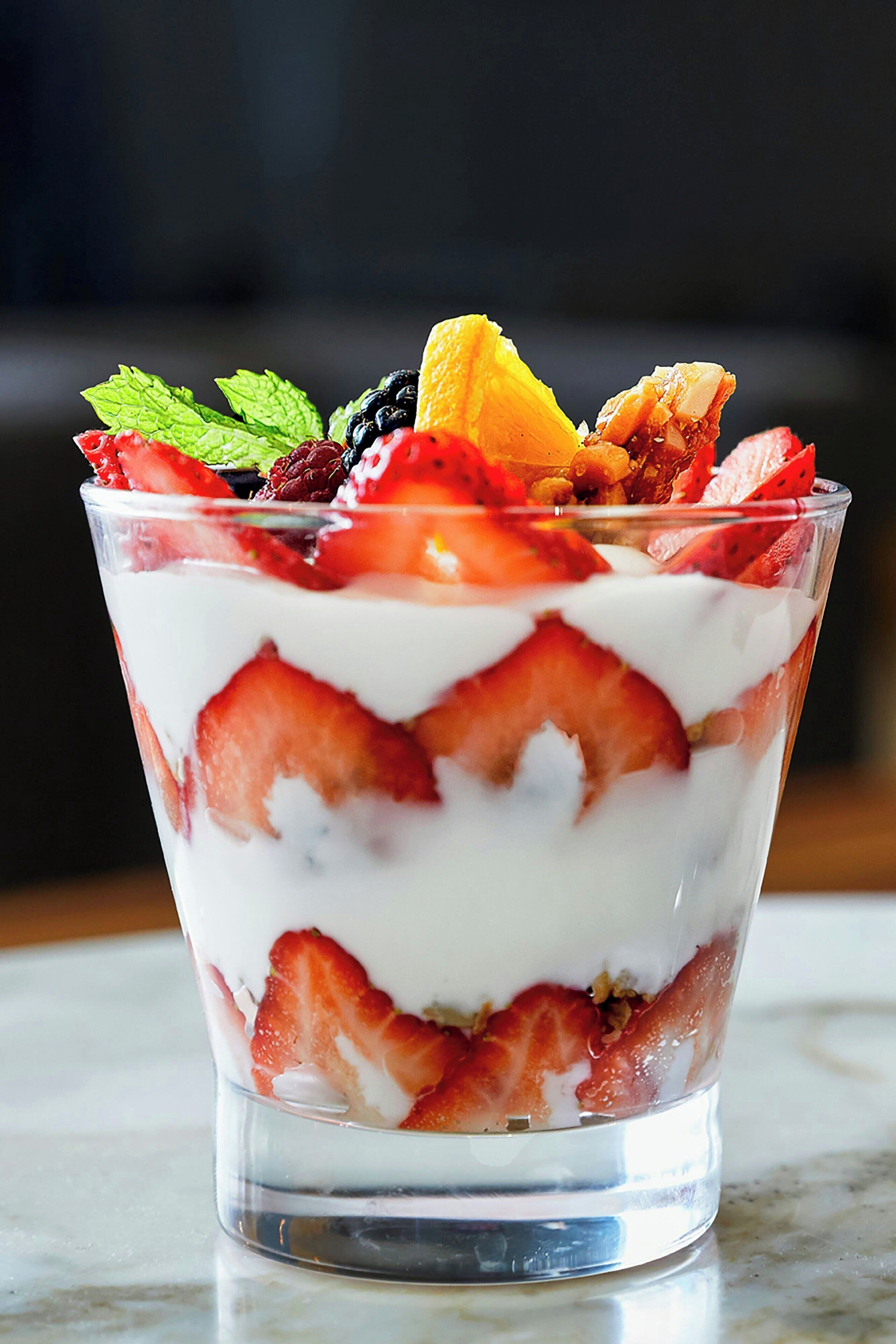 A layered dessert in a clear glass.