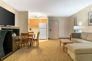 Suite, Multiple Beds, Non Smoking | Desk, laptop workspace, blackout curtains, iron/ironing board