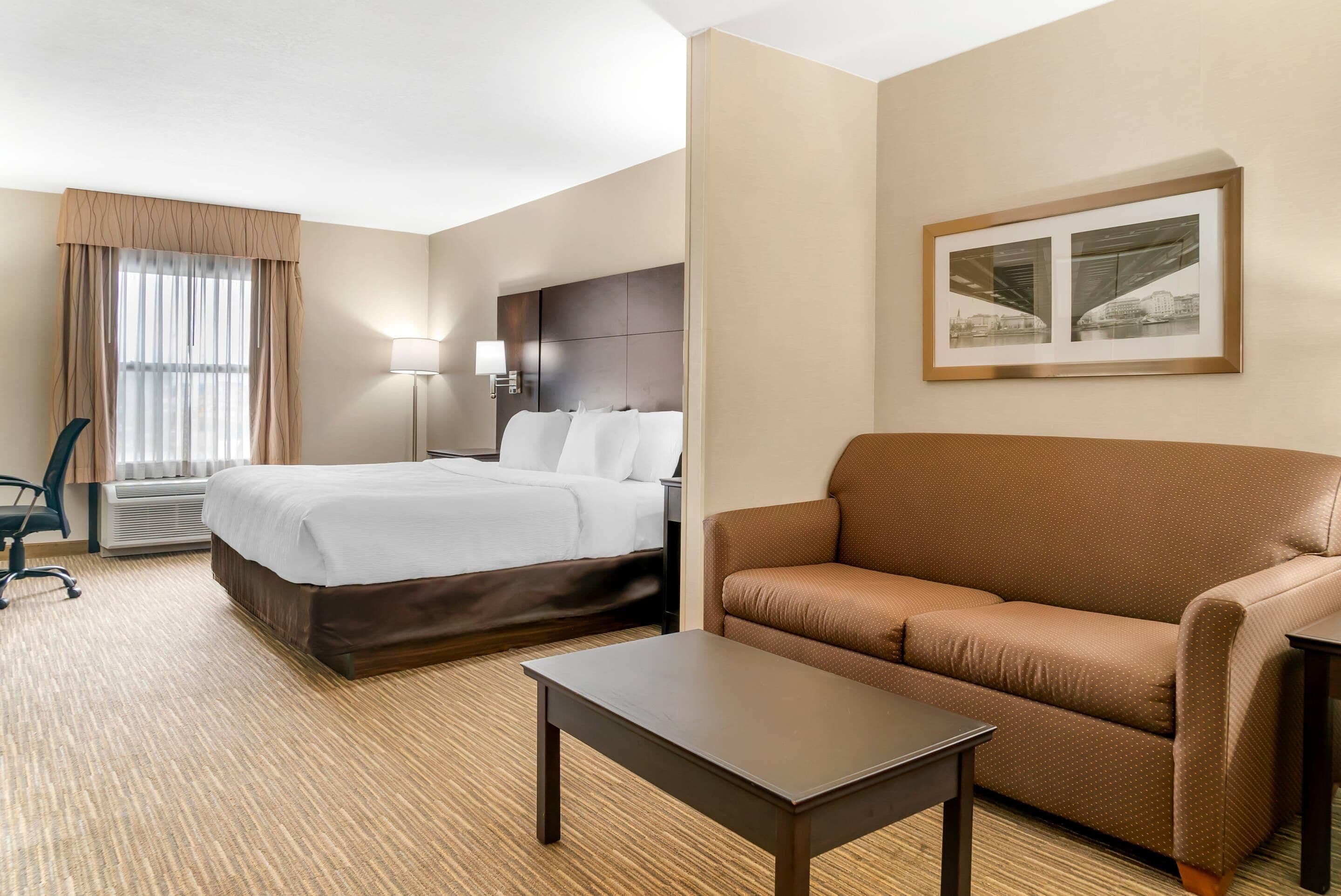 Suite, 1 King Bed with Sofa bed, Non Smoking | Desk, laptop workspace, blackout curtains, iron/ironing board
