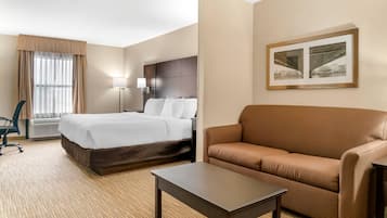 Suite, 1 King Bed with Sofa bed, Non Smoking | Desk, laptop workspace, blackout curtains, iron/ironing board