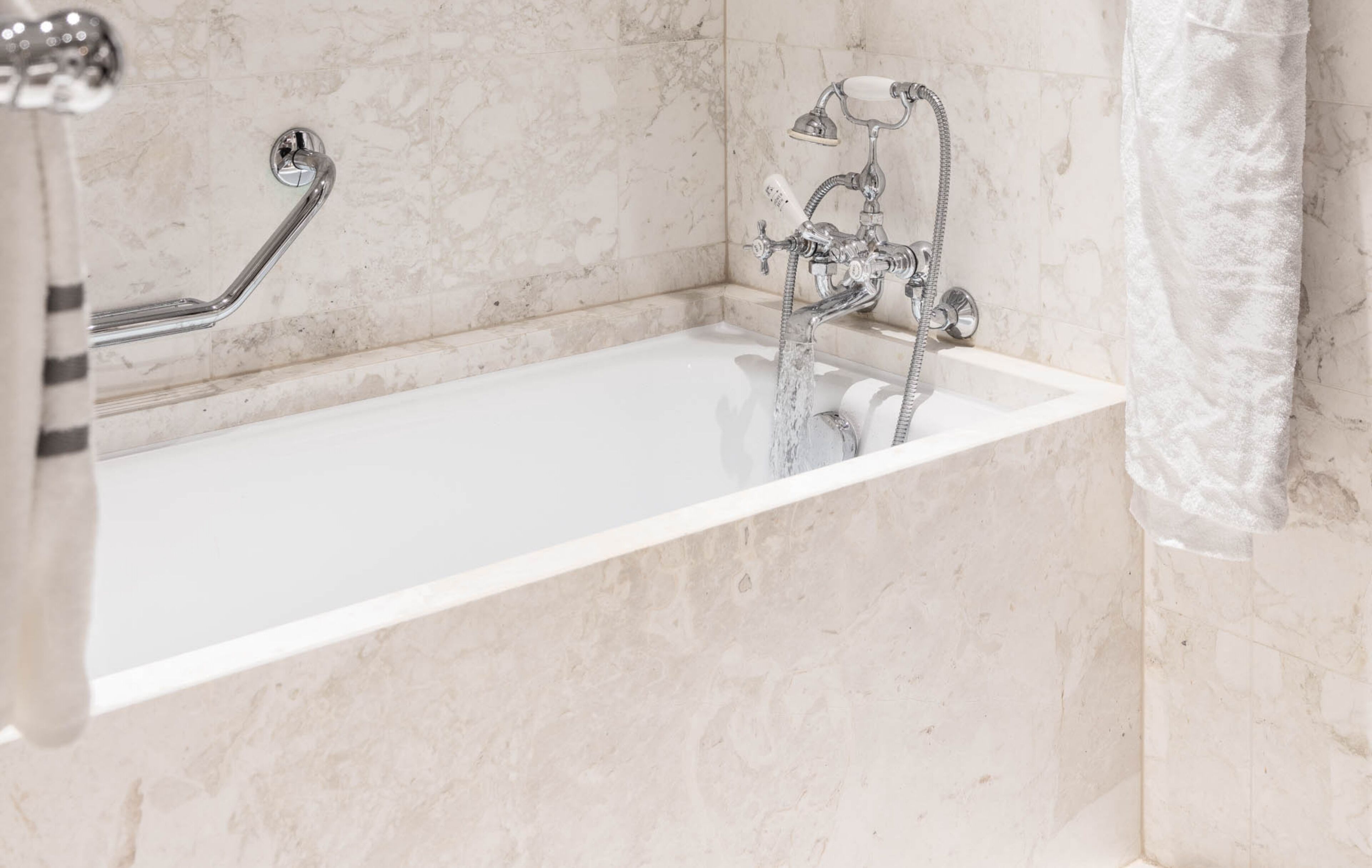 designer toiletries, hair dryer, bathrobes, slippers