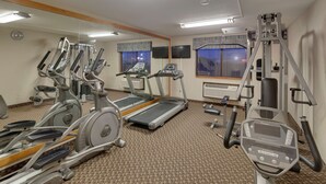 A gym with treadmills, elliptical machines, and weight equipment. - Best Western Pontiac Inn (Pontiac)