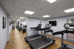 A gym with treadmills, stationary bikes, and weight machines. - Birchwood Inn, BW Premier Collection (Winnipeg)