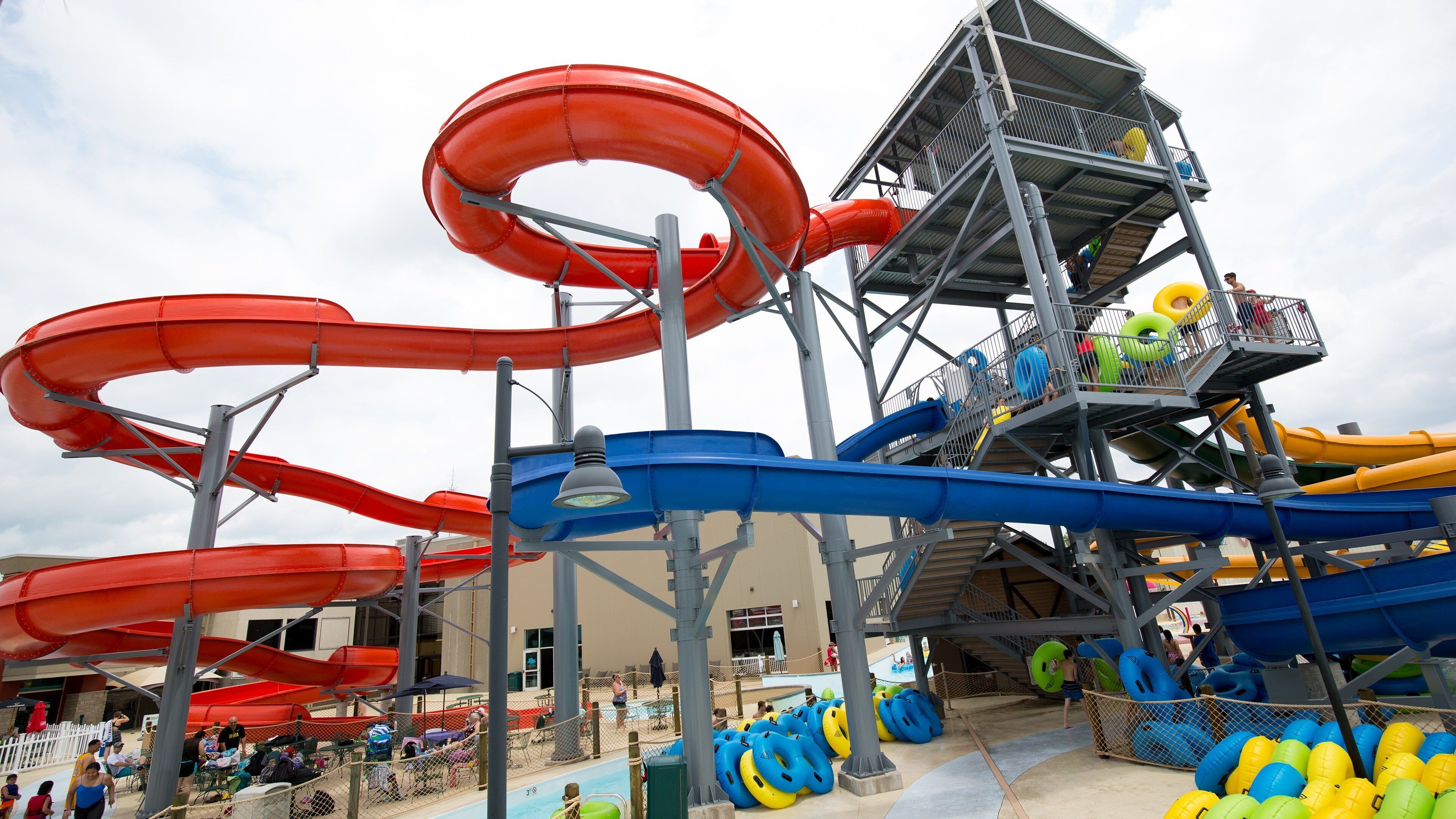 A water park with multiple slides and a pool area.