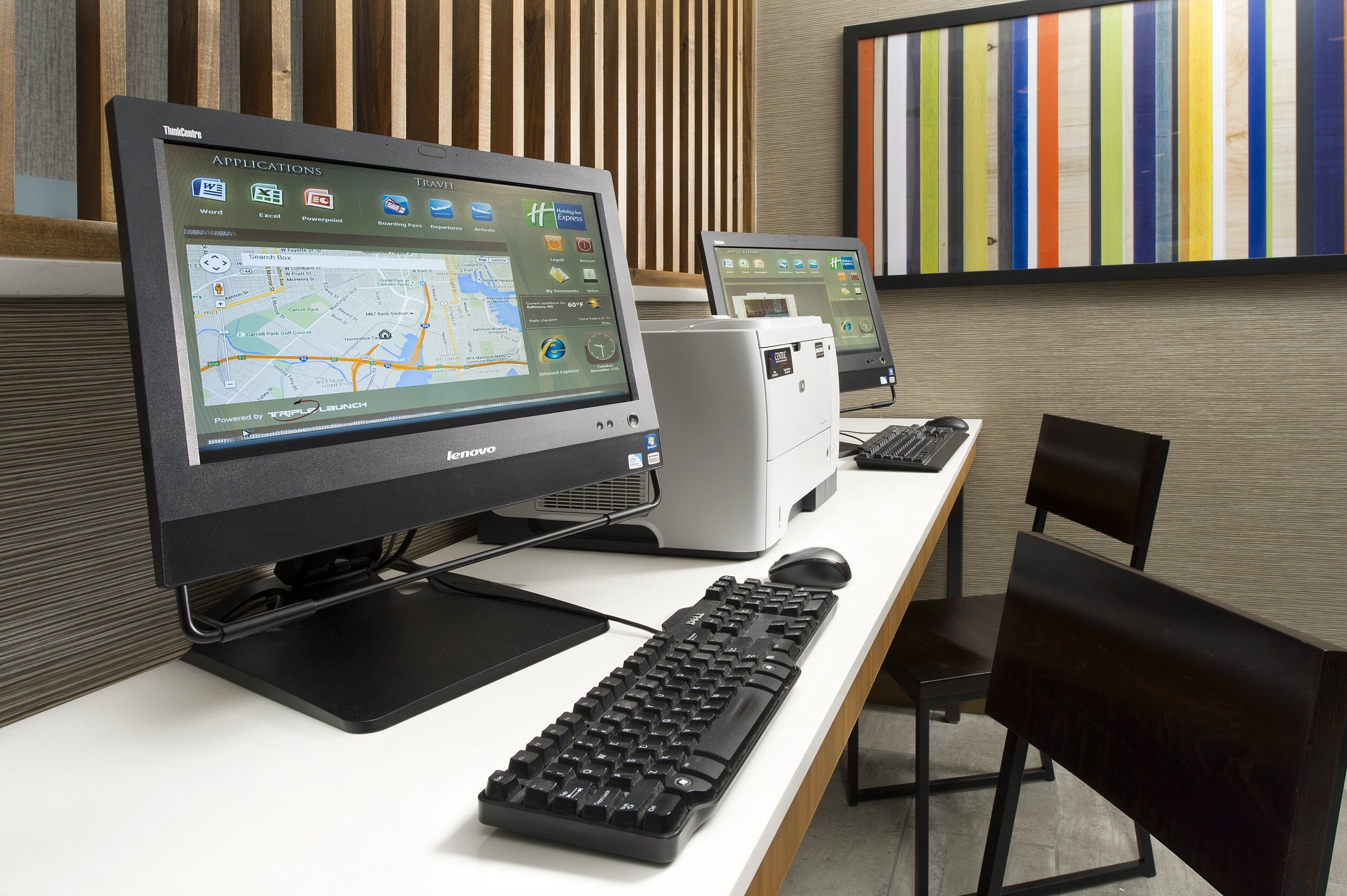 A computer desk with a desktop computer, a keyboard, and a mouse.