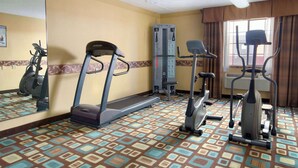 A hotel fitness room with a treadmill, elliptical, and stair climber. - Baymont by Wyndham Oklahoma City Airport (Oklahoma City)