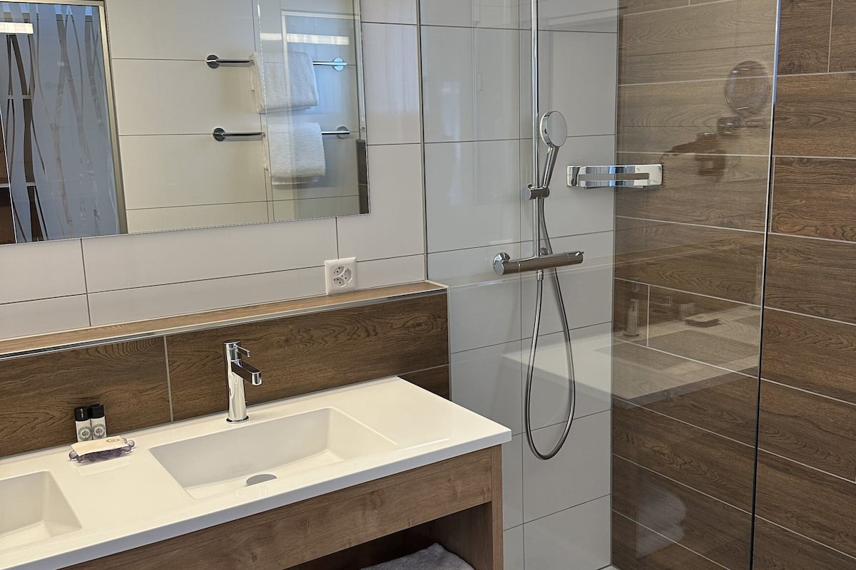 1 bedroom & 1 livingroom suite with balcony | bathroom | hair dryer