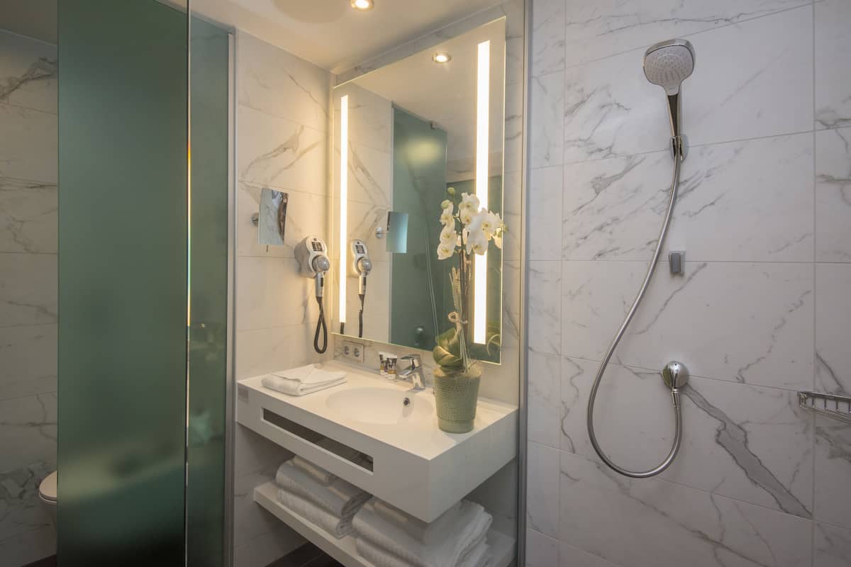 shower, eco-friendly toiletries, hair dryer, towels