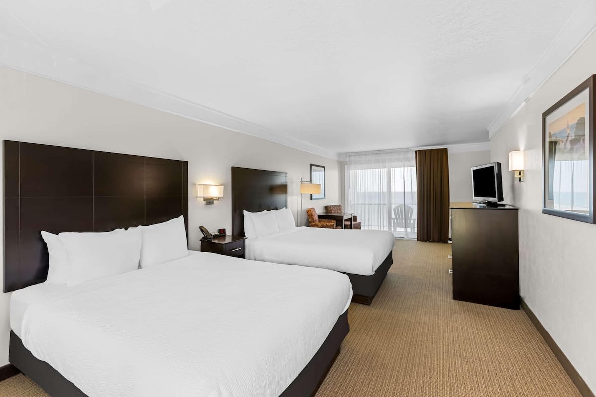 Down comforters, Select Comfort beds, laptop workspace, blackout drapes
