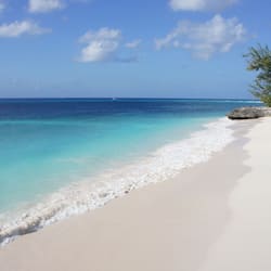 On the beach, white sand, sun-loungers, beach umbrellas
