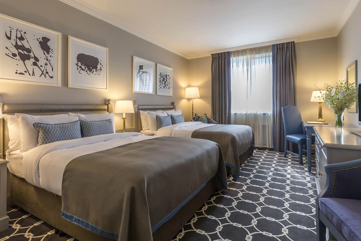 deluxe twin room | premium bedding, desk, laptop workspace, blackout curtains