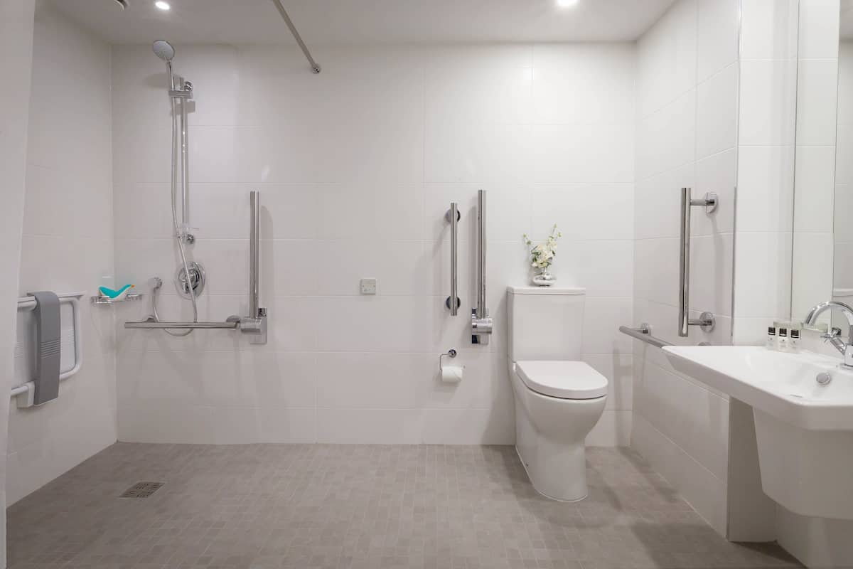 accessible room | bathroom | combined shower/bathtub, designer toiletries, hair dryer, bathrobes