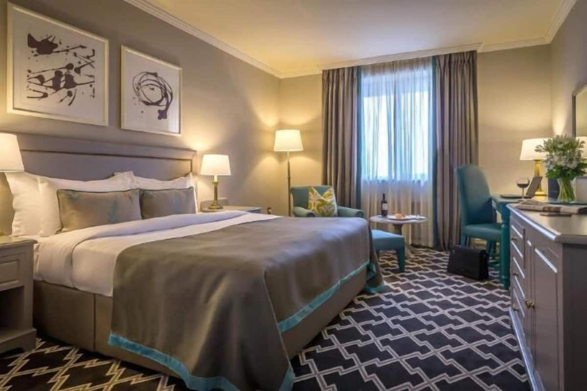 Premium bedding, desk, laptop workspace, blackout curtains