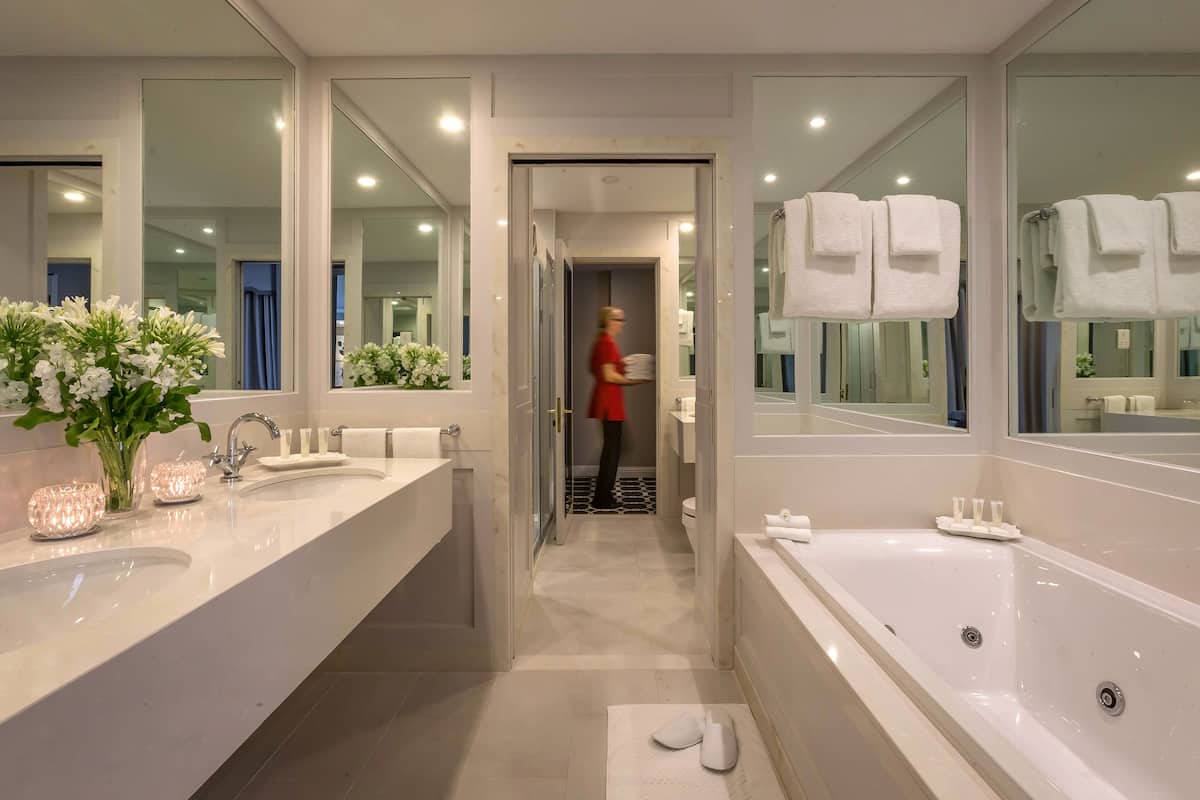 presidential suite | bathroom | combined shower/bathtub, designer toiletries, hair dryer, bathrobes