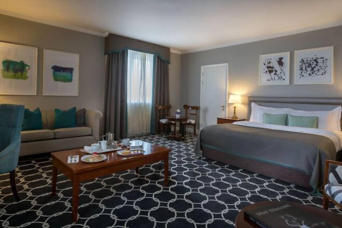 Premium bedding, desk, laptop workspace, blackout drapes