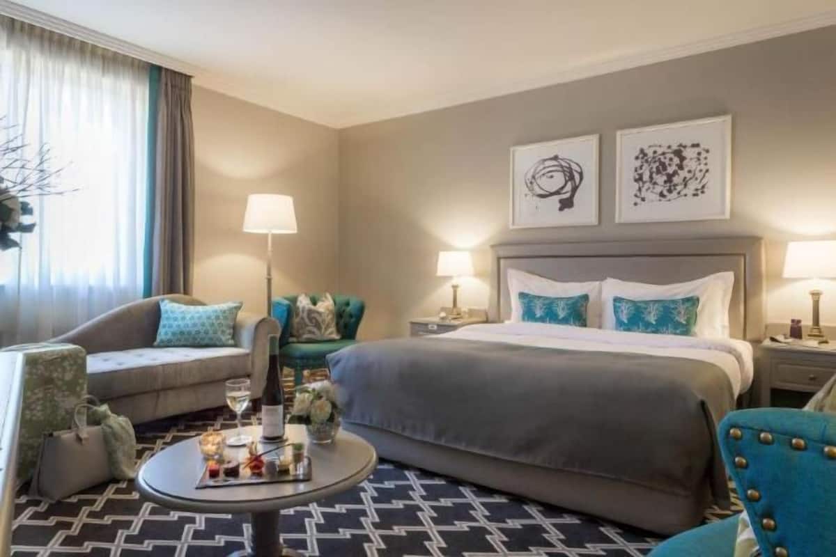 Premium bedding, desk, laptop workspace, blackout drapes
