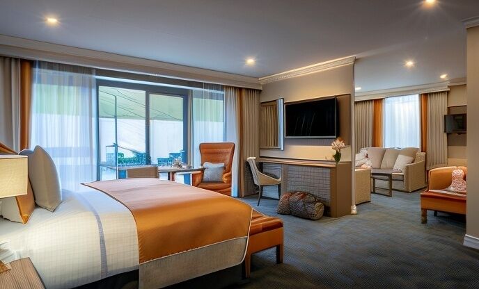 Premium bedding, desk, laptop workspace, blackout drapes